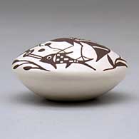 A miniature black on white seed pot decorated with a cloudeater, fish, vine and geometric design above the shoulder, click or tap to see a larger version