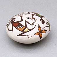 A miniature polychrome seed pot decorated with a lizard, plant and geometric design above the shoulder, click or tap to see a larger version