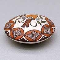 A miniature polychrome seed pot decorated with a parrot, branch and geometric design above the shoulder, click or tap to see a larger version