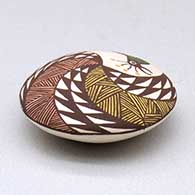 A miniature polychrome seed pot decorated with a bird, fineline and geometric design above the shoulder, click or tap to see a larger version