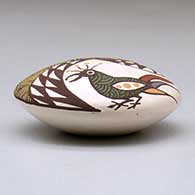 A miniature polychrome seed pot decorated with a bird, fineline and geometric design above the shoulder, click or tap to see a larger version