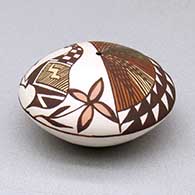 A miniature polychrome seed pot decorated with a cloudeater, fish, plant, fineline and geometric design above the shoulder, click or tap to see a larger version