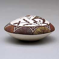 A polychrome seed pot decorated with a kokopelli, vine, fineline and geometric design above the shoulder, click or tap to see a larger version