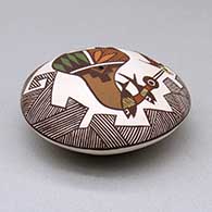 A polychrome seed pot decorated with a cloudeater, fish, fineline and geometric design above the shoulder, click or tap to see a larger version