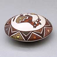 A polychrome seed pot decorated with a cloudeater, fish, fineline and geometric design above the shoulder, click or tap to see a larger version