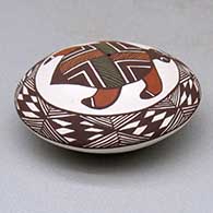 A polychrome seed pot decorated with a turtle, fineline and geometric design above the shoulder, click or tap to see a larger version