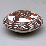 A polychrome seed pot decorated with a turtle, fineline and geometric design above the shoulder, click or tap to see a larger version