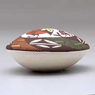 A polychrome seed pot decorated with a quail, fineline, plant and geometric design above the shoulder, click or tap to see a larger version