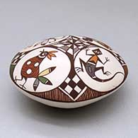 A polychrome seed pot decorated above the shoulder with a bird, lizard, turtle, dragonfly and geometric design, click or tap to see a larger version