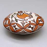 A polychrome seed pot decorated above the shoulder with a parrot, branch and geometric design, click or tap to see a larger version
