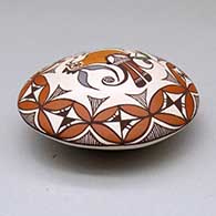 A polychrome seed pot decorated above the shoulder with a parrot, branch and geometric design, click or tap to see a larger version