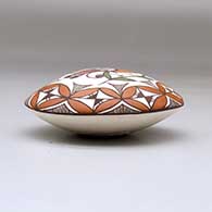 A polychrome seed pot decorated above the shoulder with a parrot, branch and geometric design, click or tap to see a larger version