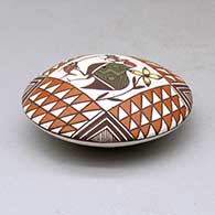 A polychrome seed pot decorated above the shoulder with a cloudeater, fish, flower and geometric design, click or tap to see a larger version