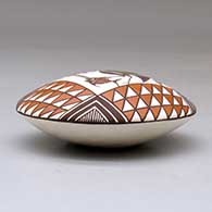 A polychrome seed pot decorated above the shoulder with a cloudeater, fish, flower and geometric design, click or tap to see a larger version