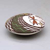 A polychrome seed pot decorated above the shoulder with a dragonfly, fish, fineline and geometric design, click or tap to see a larger version