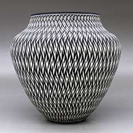 A black on white jar decorated with a lightning bolt geometric design, click or tap to see a larger version
