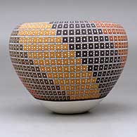 A polychrome jar with an Infinity rim and decorated with a geometric design, click or tap to see a larger version