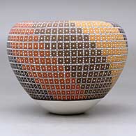 A polychrome jar with an Infinity rim and decorated with a geometric design, click or tap to see a larger version