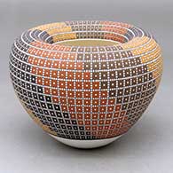A polychrome jar with an Infinity rim and decorated with a geometric design
 by Frederica Antonio of Acoma