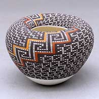Click for a larger view A small polychrome bowl with an Infinity rim and decorated with a two-panel tiny square geometric design
by Frederica Antonio of Acoma