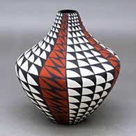 A polychrome tear drop jar decorated with a four-panel geometric design
 by Sandra Victorino of Acoma