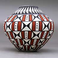 A polychrome jar decorated with a geometric design, click or tap to see a larger version