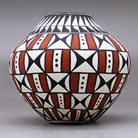 A polychrome jar decorated with a geometric design, click or tap to see a larger version