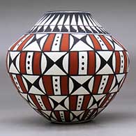 A polychrome jar decorated with a geometric design, click or tap to see a larger version