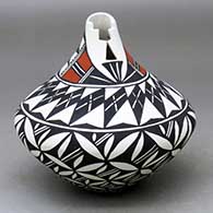 A polychrome tear drop jar with a kiva step cut opening and decorated with a pumpkin seed snowflake and geometric design
 by Sandra Victorino of Acoma