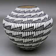 A black on white jar decorated with a geometric design
 by Sandra Victorino of Acoma