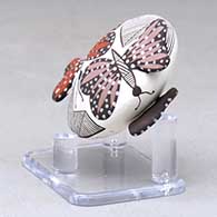 A miniature polychrome seed pot decorated with butterfly wing appliques and a butterfly, fineline and geometric design, click or tap to see a larger version