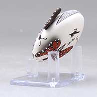 A miniature polychrome seed pot decorated with butterfly wing appliques and a butterfly, fineline and geometric design, click or tap to see a larger version