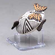 A miniature polychrome seed pot decorated with butterfly wing appliques and a butterfly, fineline and geometric design, click or tap to see a larger version