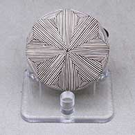 A miniature black on white seed pot decorated with a butterfly wing applique and a butterfly, fineline and geometric design
 by Alisha Sanchez of Acoma