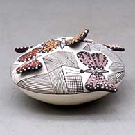A polychrome seed pot decorated with butterfly wing appliques and a butterfly, fineline and geometric design, click or tap to see a larger version