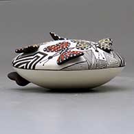 A polychrome seed pot decorated with butterfly wing appliques and a butterfly, fineline and geometric design, click or tap to see a larger version