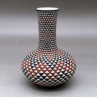 A tall-necked polychrome vase decorated with a spiral mesa geometric design
 by Paula Estevan of Acoma