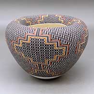 Click for a larger view A polychrome jar with an Infinity rim and decorated with a geometric design built of tiny squares
by Frederica Antonio of Acoma