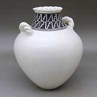 A black on white jar with a pie crust rim, twisted rope handles and a geometric design around the neck
 by Lilly M Salvador of Acoma