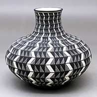 Click for a larger view A black on white jar decorated with a lightning bolt, fineline and geometric design
by Paula Estevan of Acoma