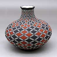Click for a larger view A polychrome jar with a short neck and and pie crust rim, decorated around the whole with a spiraling checkerboard and geometric design
by Paula Estevan of Acoma