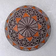 A polychrome seed pot decorated above the shoulder with a fineline and geometric design
 by Amanda Lucario of Acoma