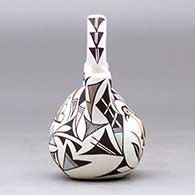 A small polychrome wedding vase decorated with a parrot, butterfly and geometric design, click or tap to see a larger version