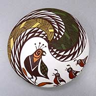 A polychrome seed pot decorated with a dragonfly, fineline and geometric design
 by Diane Lewis of Acoma