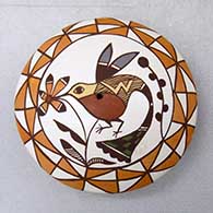 Click for a larger view A miniature polychrome seed pot decorated with a hummingbird, flower and geometric design
by Diane Lewis of Acoma