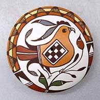 A miniature polychrome seed pot decorated with a parrot, branch and geometric design
 by Diane Lewis of Acoma