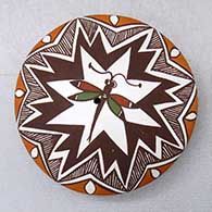 A miniature polychrome seed pot decorated with a dragonfly, lightning bolt, fineline and geometric design
 by Diane Lewis of Acoma