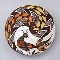 A miniature polychrome seed pot decorated with a peacock, fineline and geometric design
 by Diane Lewis of Acoma