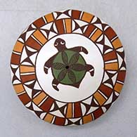 A miniature polychrome seed pot decorated with a turtle and geometric design
 by Diane Lewis of Acoma