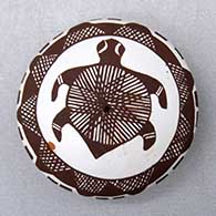 Click for a larger view A miniature black on white seed pot decorated with a turtle, fineline and geometric design
by Diane Lewis of Acoma